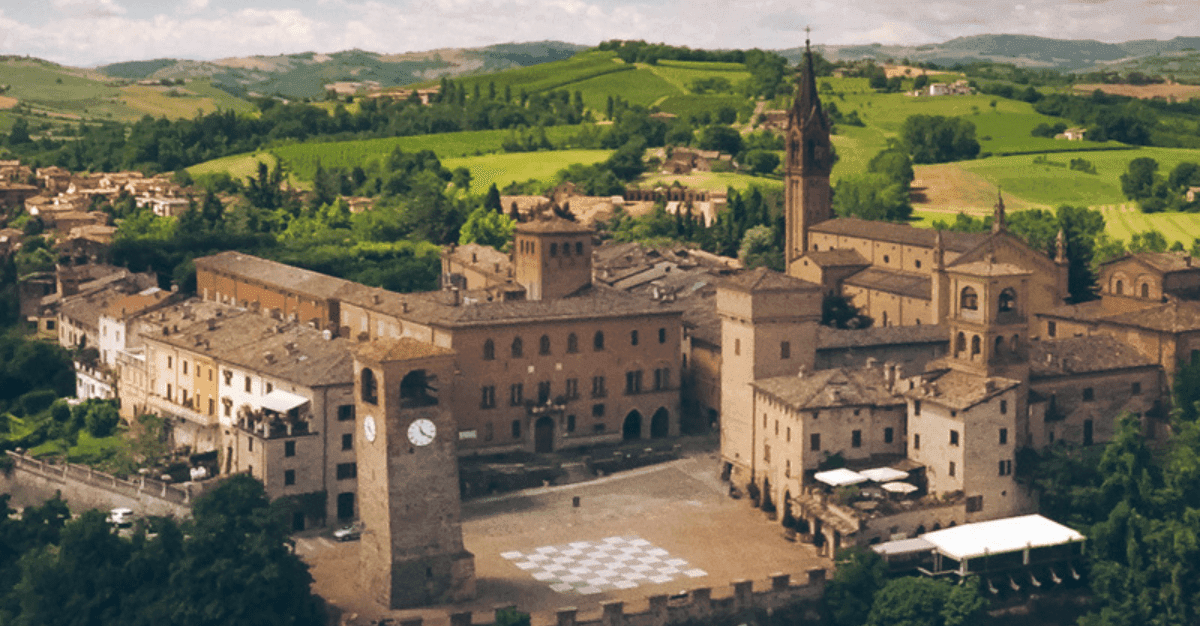 The hill village of Castelvetro di Modena, with its chequerboard square, in the Lambrusco hills